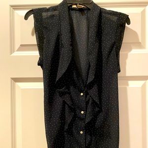 A navy, polka dot, blouse